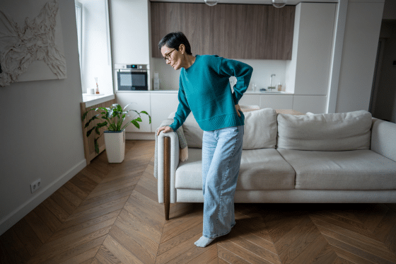 A woman struggles with low back pain